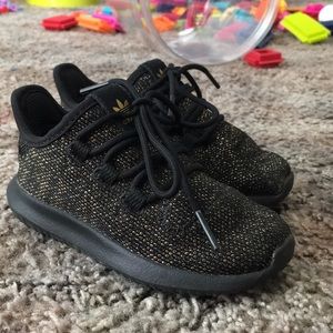 Black and gold Adidas